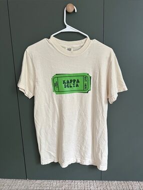 Kappa Delta Cream Graphic Tee with Green Ticket Print